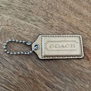Coach Gold leather Hang Tag